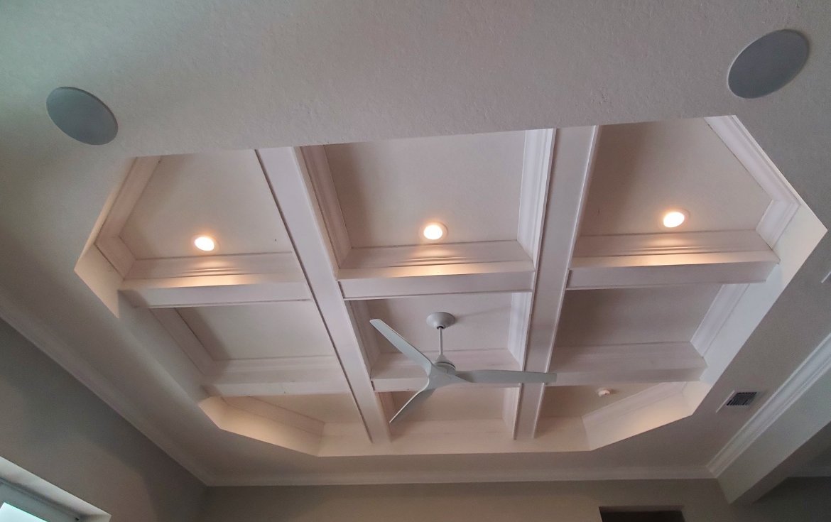 Coffered ceiling with recessed lighting and fan