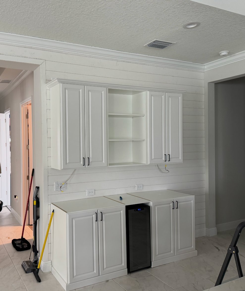 Shiplap wall with RTA upper and lower cabinets and wine fridge